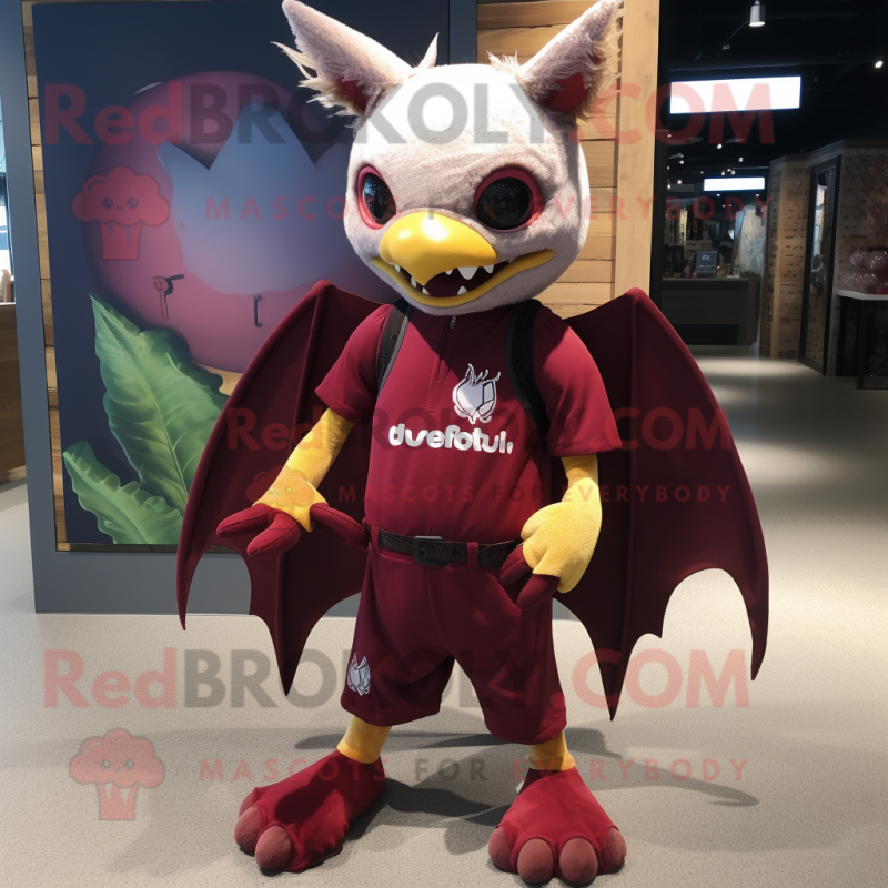 Maroon Fruit Bat mascot costume character dressed with a Rash Guard and Shoe laces