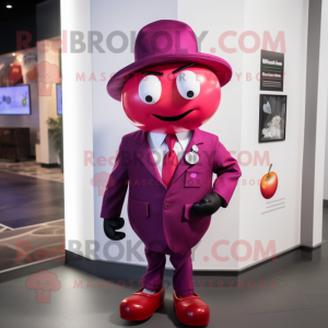 Magenta Apple mascot costume character dressed with a Suit Jacket and Hat pins