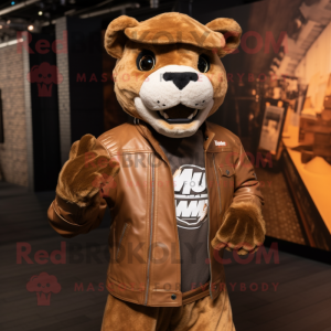 Brown Puma mascot costume character dressed with a Moto Jacket and Headbands