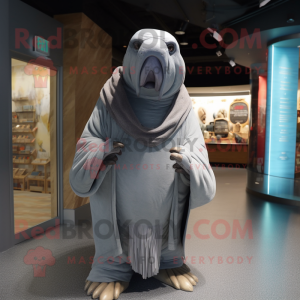 Gray Walrus mascot costume character dressed with a Long Sleeve Tee and Shawl pins