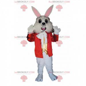 Vit kaninmaskot med en röd jacka och en guldväst -