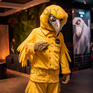 Yellow Vulture mascot costume character dressed with a Jumpsuit and Lapel pins