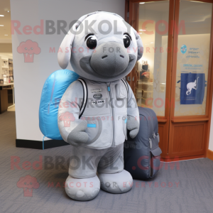 Gray Stellar'S Sea Cow mascot costume character dressed with a Jacket and Messenger bags