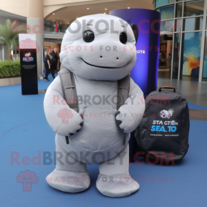 Gray Stellar'S Sea Cow mascot costume character dressed with a Jacket and Messenger bags