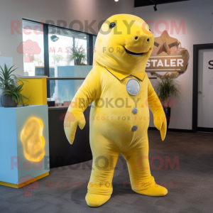 Yellow Stellar'S Sea Cow mascot costume character dressed with a Playsuit and Tie pins