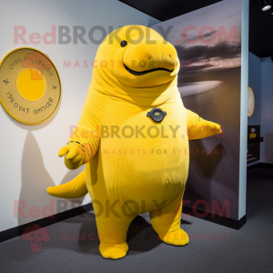 Yellow Stellar'S Sea Cow mascot costume character dressed with a Playsuit and Tie pins