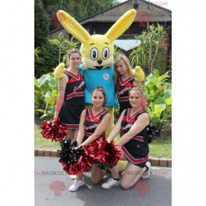 Mascotte de lapin jaune avec un t-shirt bleu - Redbrokoly.com