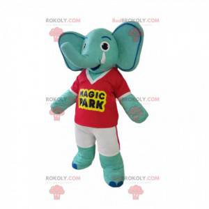 Mascote elefante azul com camiseta vermelha e shorts amarelos -