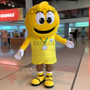 Lemon Yellow Donut mascot costume character dressed with a Polo Shirt and Shoe laces