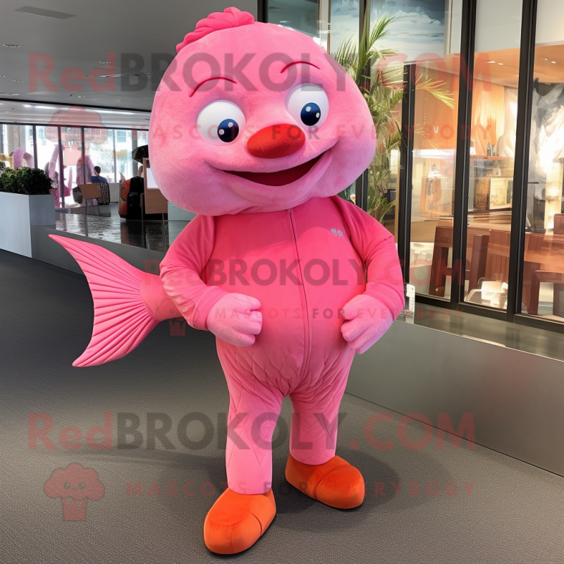 Pink Goldfish mascot costume character dressed with a Henley Tee and Foot pads