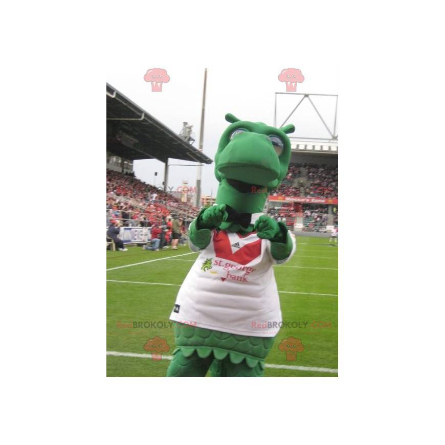 Mascote do dinossauro dragão verde com uma camisa esportiva -