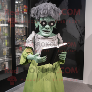 Silver Frankenstein'S Monster mascot costume character dressed with a Empire Waist Dress and Reading glasses