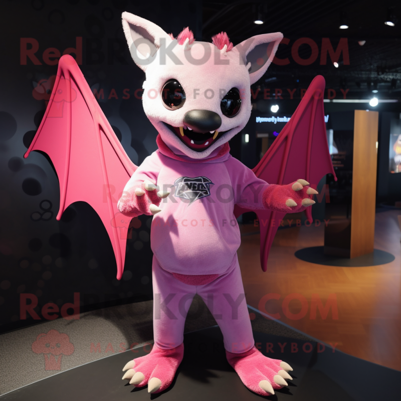 Pink Bat mascot costume character dressed with a Graphic Tee and Cufflinks