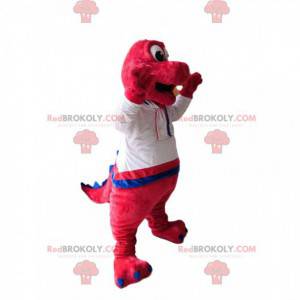 Mascotte de dinosaure fushia avec une chemise blanche -