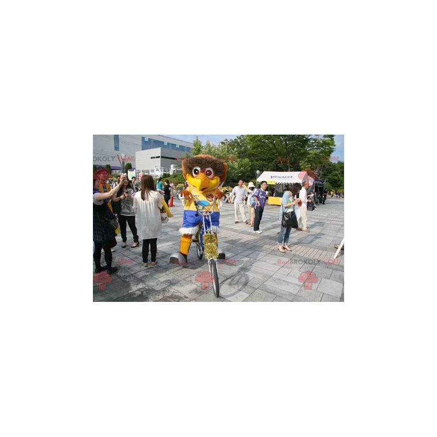 Mascota pájaro marrón grande con un traje colorido - Mascota pájaro marrón grande con un traje colorido -