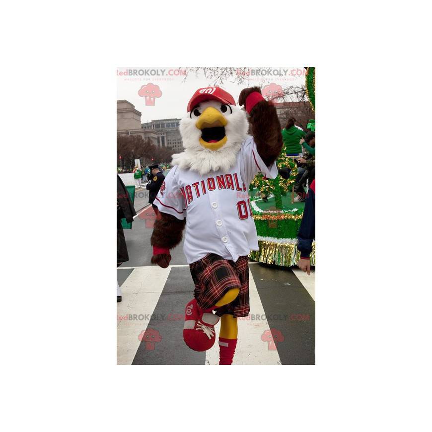 Mascota águila blanca y marrón en ropa deportiva con falda Mascota águila blanca y marrón en ropa deportiva con falda