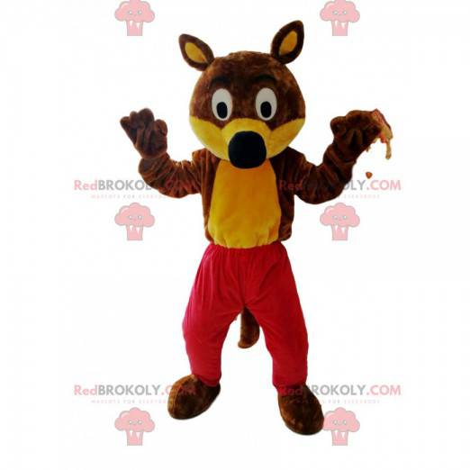Divertida mascota lobo marrón y amarillo con pantalones rojos -