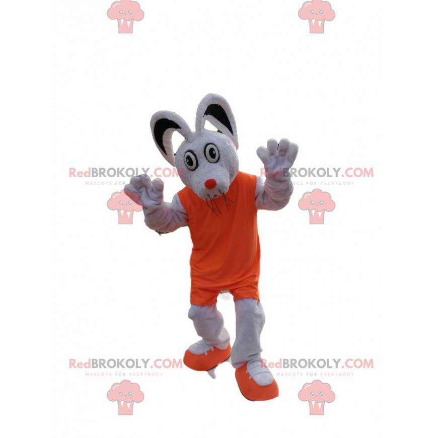 Weißes Mausmaskottchen mit einem orangefarbenen Outfit -