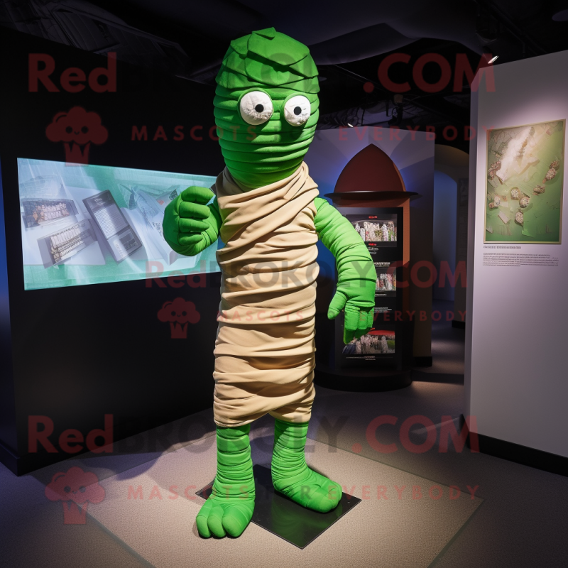 Green Mummy mascot costume character dressed with a Chinos and Wraps Green Mummy mascot costume character dressed with a Chinos and Wraps
