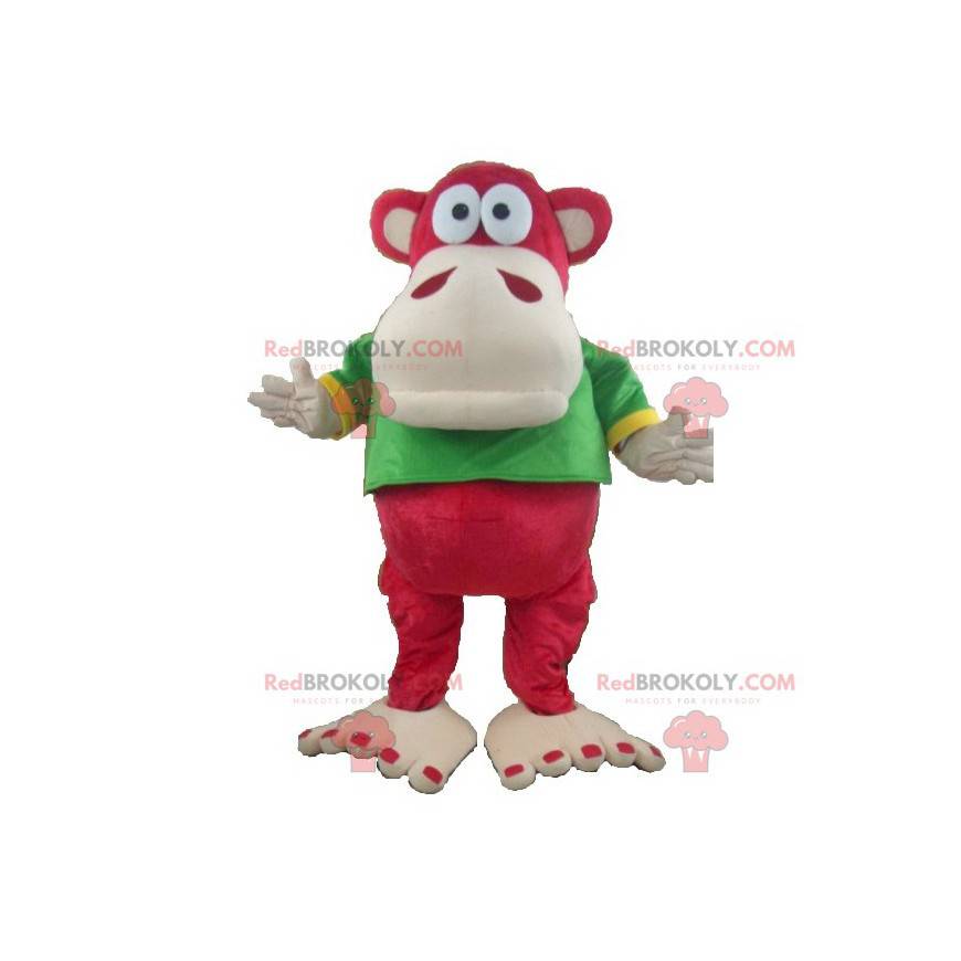 Mascota mono rojo y beige con una camiseta verde y amarilla -