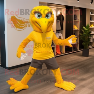Yellow Eagle mascot costume character dressed with a Running Shorts and Caps