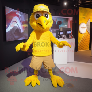 Yellow Eagle mascot costume character dressed with a Running Shorts and Caps