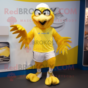 Yellow Eagle mascot costume character dressed with a Running Shorts and Caps