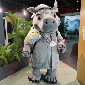 Gray Rhinoceros mascot costume character dressed with a Raincoat and Briefcases