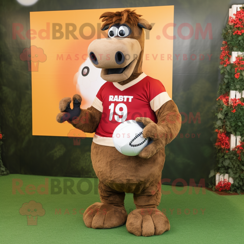 Rust Camel mascot costume character dressed with a Rugby Shirt and Clutch bags