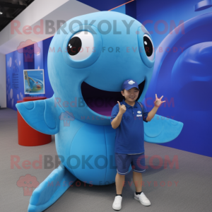 Blue Whale mascot costume character dressed with a Graphic Tee and Rings