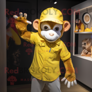Yellow Monkey mascot costume character dressed with a Oxford Shirt and Beanies