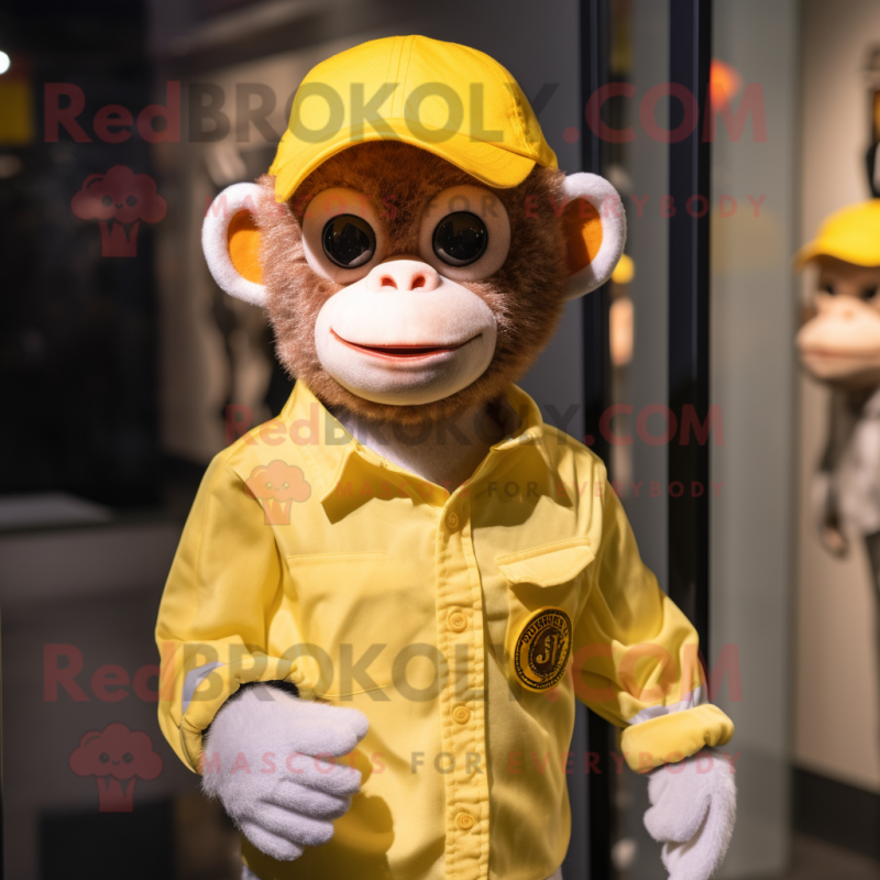 Yellow Monkey mascot costume character dressed with a Oxford Shirt and Beanies