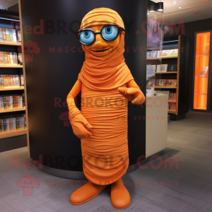 Orange Mummy mascot costume character dressed with a Maxi Dress and Reading glasses