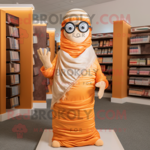 Orange Mummy mascot costume character dressed with a Maxi Dress and Reading glasses
