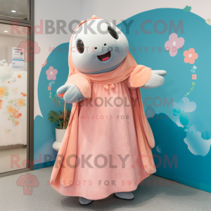 Peach Stellar'S Sea Cow mascot costume character dressed with a Midi Dress and Shawls