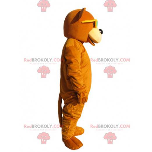 Mascota del oso naranja con gafas de sol amarillas -