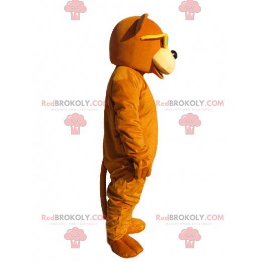 Mascote urso laranja com óculos de sol amarelos - Redbrokoly.com