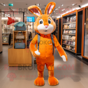 Orange Wild Rabbit mascot costume character dressed with a Jumpsuit and Handbags