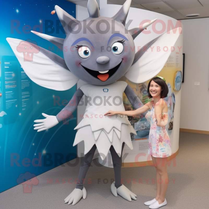 Gray Tooth Fairy mascot costume character dressed with a One-Piece Swimsuit and Brooches Gray Tooth Fairy mascot costume character dressed with a One-Piece Swimsuit and Brooches