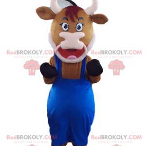 Hnědá kráva maskot s modrým overalem - Redbrokoly.com