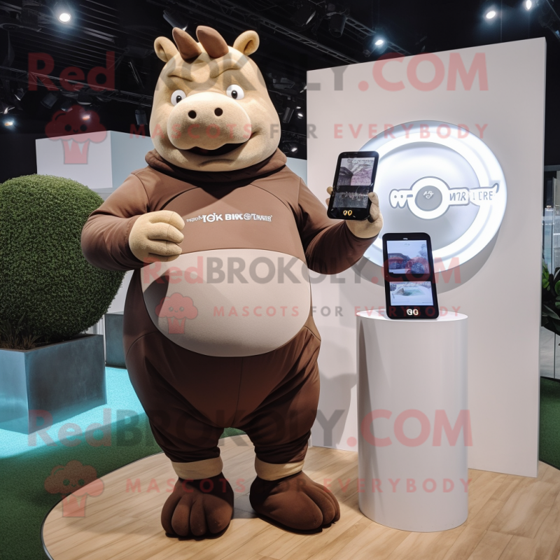 Brown Rhinoceros mascot costume character dressed with a One-Piece Swimsuit and Smartwatches