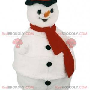Mascota del muñeco de nieve con una bufanda roja y un sombrero