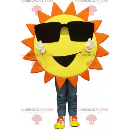 Mascotte de soleil jaune et orange avec des lunettes de soleil