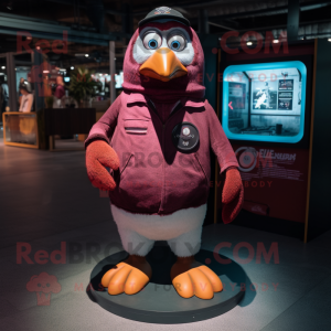 Maroon Penguin mascot costume character dressed with a Denim Shorts and Digital watches