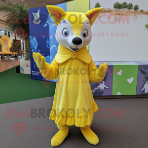 Lemon Yellow Dingo mascot costume character dressed with a Pleated Skirt and Mittens