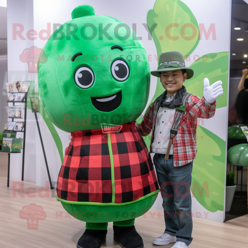 Green Watermelon mascot costume character dressed with a Flannel Shirt and Berets Green Watermelon mascot costume character dressed with a Flannel Shirt and Berets