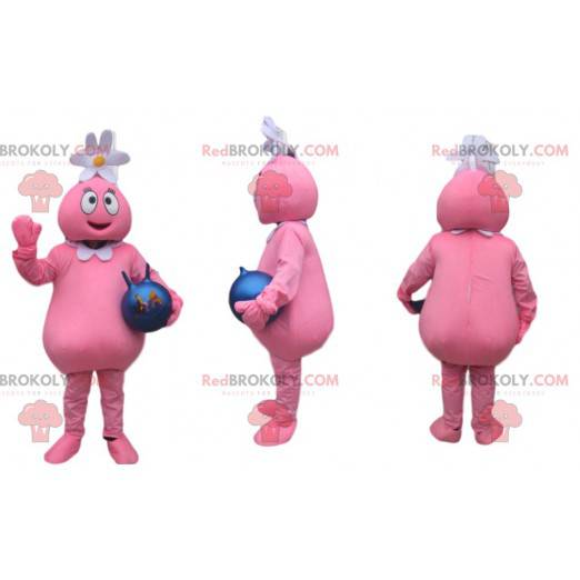 Lustiges rosa Charaktermaskottchen, das ein Gänseblümchen trägt