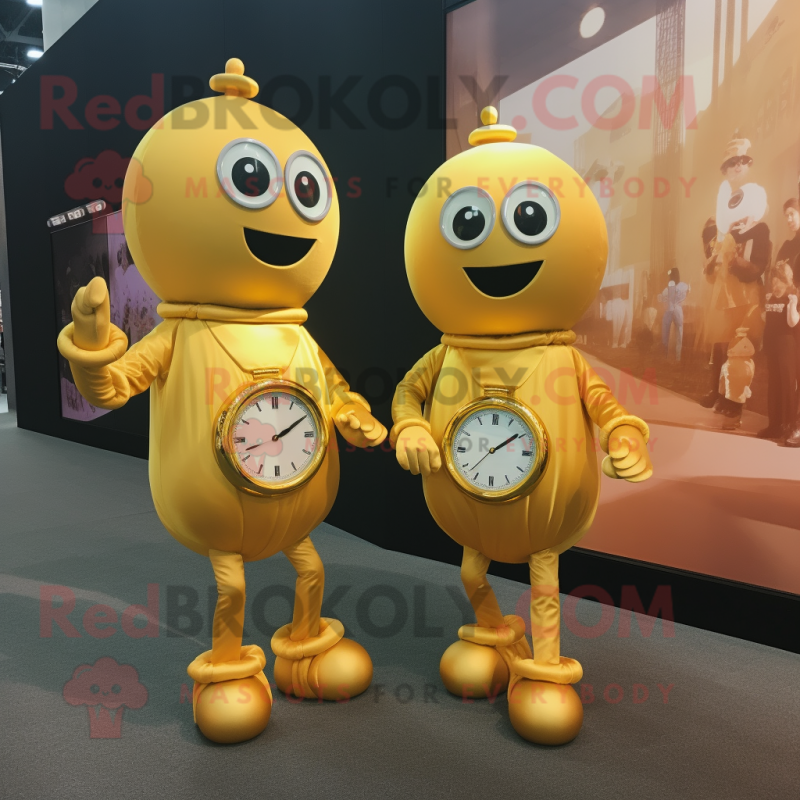 Gold Meatballs mascot costume character dressed with a A-Line Dress and Smartwatches