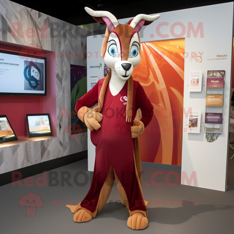 Maroon Gazelle mascot costume character dressed with a Graphic Tee and Wraps Maroon Gazelle mascot costume character dressed with a Graphic Tee and Wraps