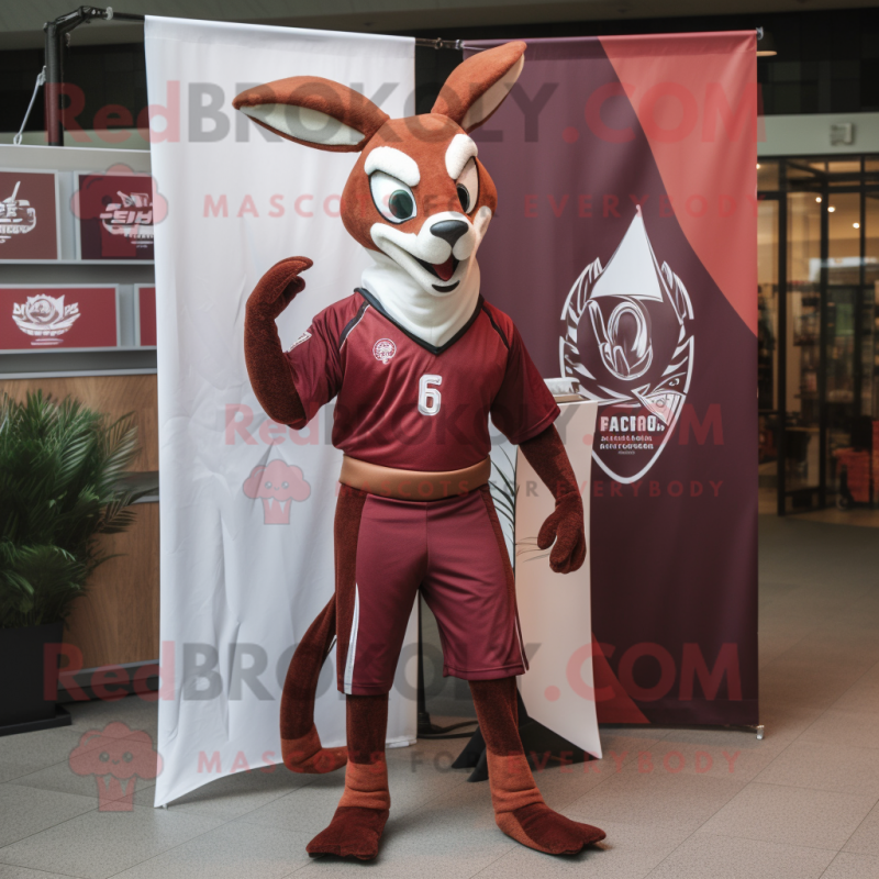 Maroon Gazelle mascot costume character dressed with a Graphic Tee and Wraps